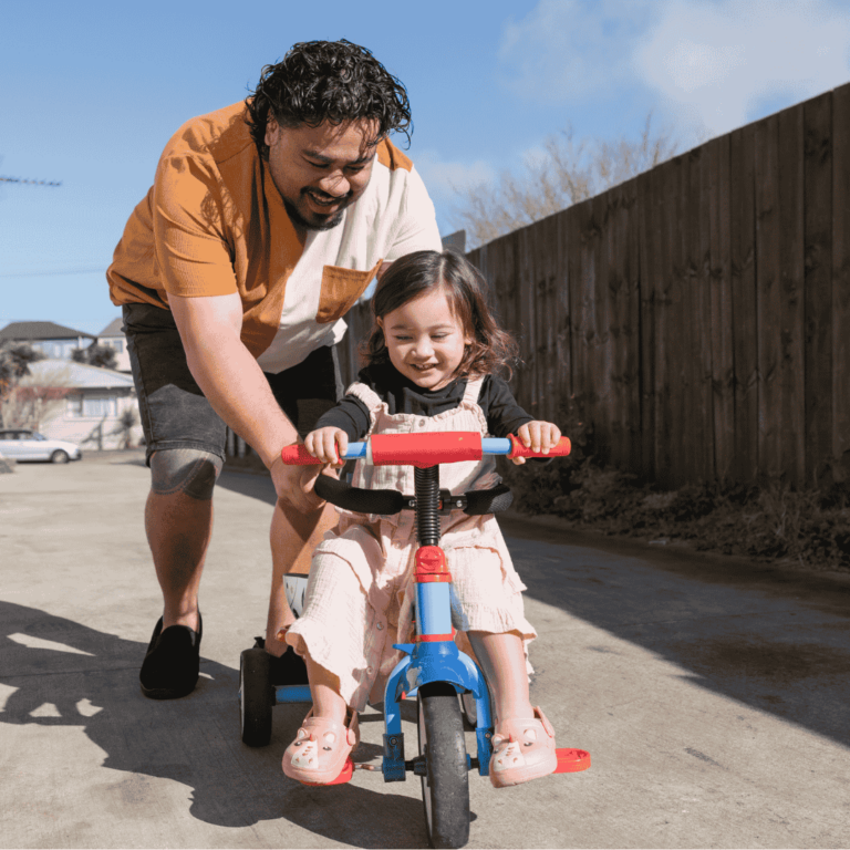 dad and daughter riding bike
